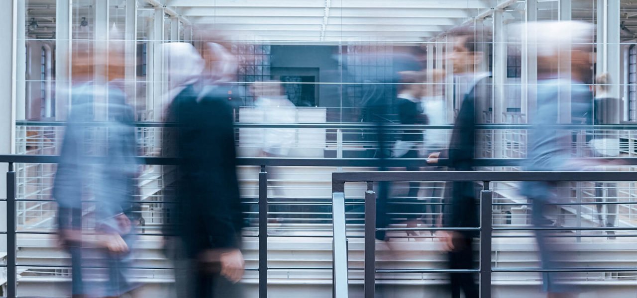 business-people-talking-in-corridor